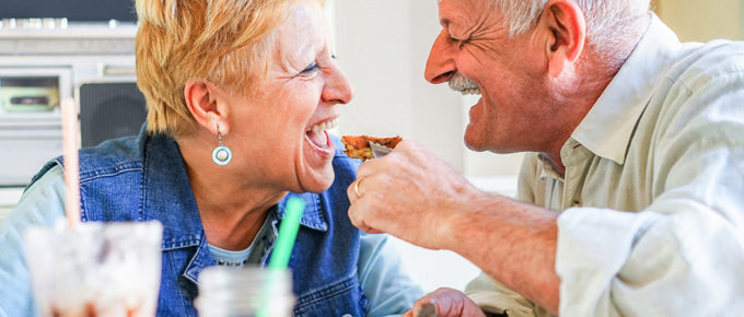 a senior couple eating