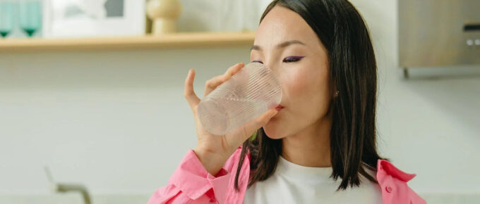 woman drinking ionized water